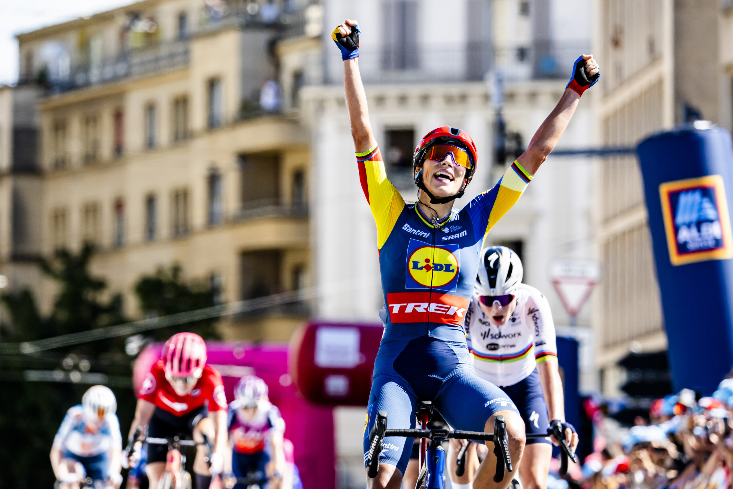 The winner of the stage Elisa Balsamo from Italy of team Lidl-Trek celebrates as she crosses the finish line during the first stage, a 133,8 km race between La Grande Beroche and Lausanne at the 3rd Tour de Romandie Feminin UCI Women's World Tour cycling race in Lausanne, Switzerland, Friday, September 6, 2024. (KEYSTONE/Jean-Christophe Bott)